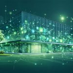 Illustration of a modern building with interconnected IoT devices and smart sensors, highlighting the role of HVAC energy management systems in optimizing building efficiency.