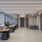 Modern office lobby with ceiling LED lighting creating soft, adaptive illumination across desks and walkways in a smart building setting.